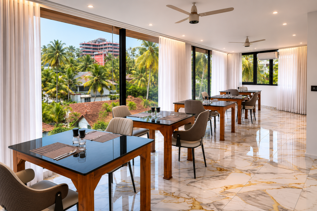 Restaurant dining area at Hotel Materhorn with tropical garden and sea view, Kovalam